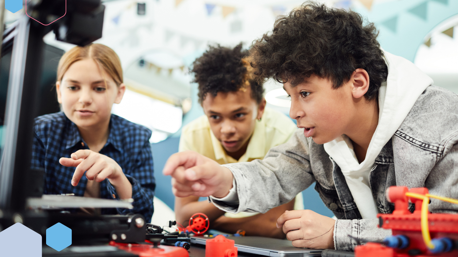 STEM students with computers and robots