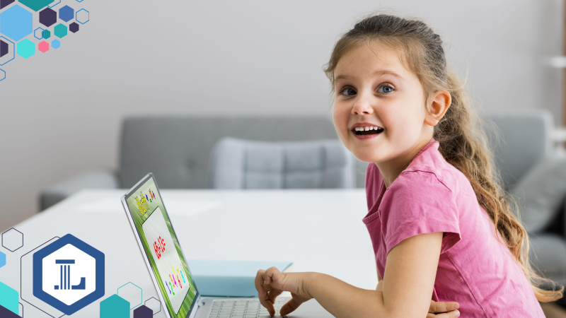 Elementary girl playing a mathematics game on a laptop computer