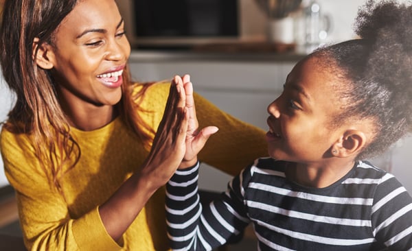 Mother-Daughter giving a high five