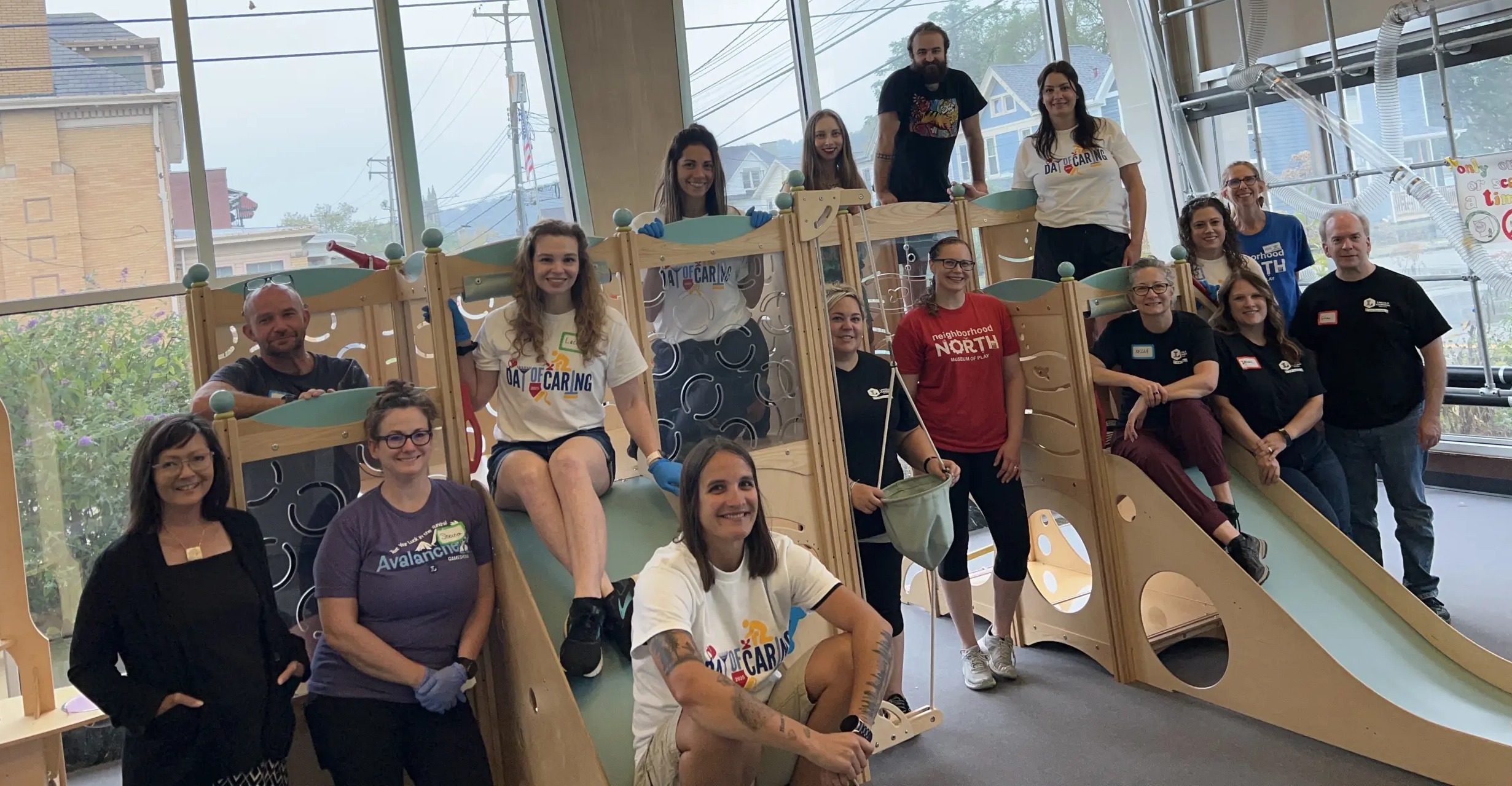 A group of male and female volunteers at a children's museum