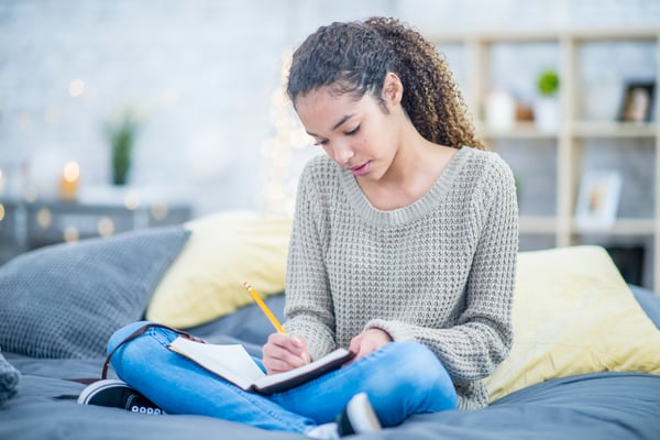 teen with journal